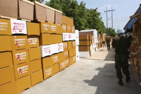 THAILAND, "Phang Nga District,", Takua Pa, "Tsunami. Hundereds of coffins waiting to be used inside