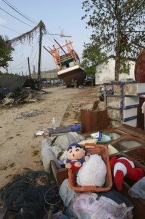 THAILAND, Phang Nga District, Nam Khem, "Tsunami. Childrens toys ly piled up and Boats have been