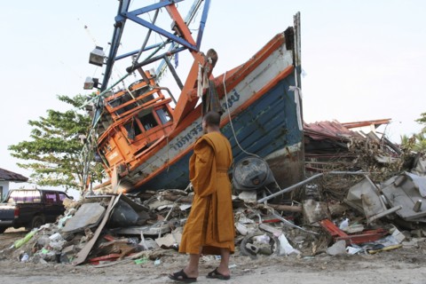 THAILAND, Phang Nga District, Nam Khem, "Tsunami. Monk looks at the damage caused by the tsunami,