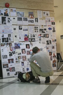 THAILAND, Phang Nga District, Phuket, "Tsunami. A french tourist grieves while looking at pictures
