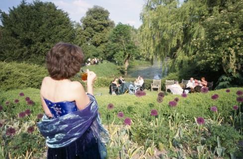 ENGLAND, East Sussex, Glyndebourne, Opera attendees enjoying picnics in the gardens during interval
