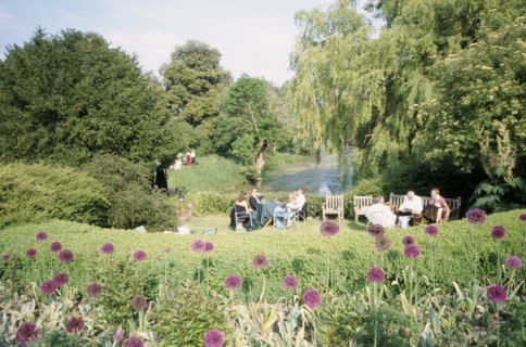 ENGLAND, East Sussex, Glyndebourne, Opera attendees enjoying picnics in the gardens during interval