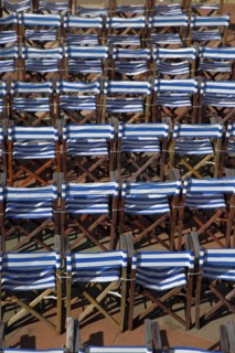 ENGLAND, East Sussex, Eastbourne, Details of blue and white deck chairs at the band stand.
