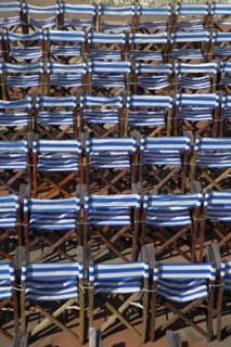 ENGLAND, East Sussex, Eastbourne, Details of blue and white deck chairs at the band stand.