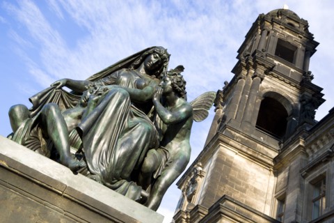 GERMANY, Saxony, Dresden, Bronze statue of a woman and winged angels on the Bruhl Terrace beside