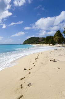 WEST INDIES, St Vincent & The Grenadines, Canouan, South Glossy Beach in Glossy bay with footprints