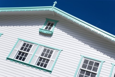 WEST INDIES, Grenada, Carriacou, Hillsborough Turqoise and white wooden clapperboard house detail
