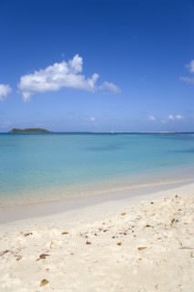 WEST INDIES, Grenada, Carriacou, Waves breaking on Paradise Beach at L'Esterre Bay with the