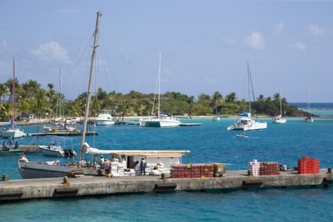 WEST INDIES, St Vincent & The Grenadines, Union Island, Inter island supply boat unloading