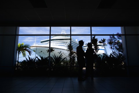 WEST INDIES, Grenada, St George, Tourists in the terminal building looking at the cruise ship