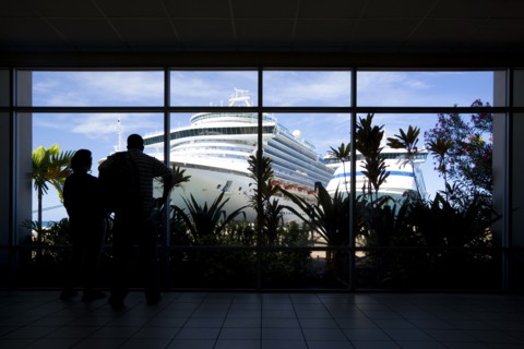 WEST INDIES, Grenada, St George, Tourists in the terminal building looking at the cruise ship