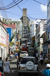WEST INDIES, Grenada, St George, St Juille Street with overhead power cables busy with traffic and