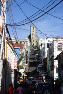 WEST INDIES, Grenada, St George, St Juille Street with overhead power cables busy with traffic and