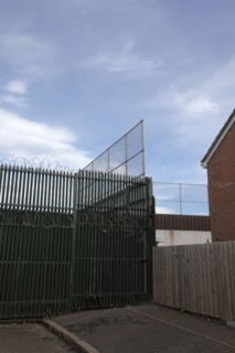 IRELAND, North, Belfast, "West, Falls Road, Peace Line barrier between the Catholic Lower Falls and