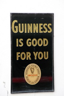 IRELAND, North, Belfast, "Cathedral Quarter, Commerical Court, Old metal Guinness sign decorating