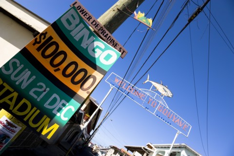 WEST INDIES, Grenada, St John, Town of Gouyave with a metal sign above the main road through the