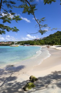 WEST INDIES, Grenada, St George, Gentle waves on BBC Beach in Morne Rouge Bay with tourists in the