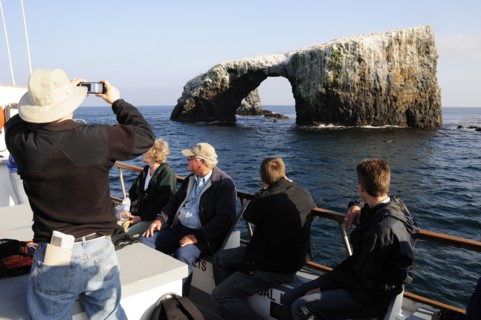 USA, California, Anacapa Island, "Tour boat passing Arch Rock, East Anacapa, Channel Isles"