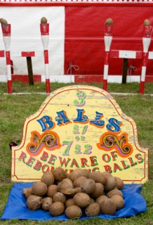 ENGLAND, West Sussex, Findon, Findon village Sheep Fair Coconut shy with sign reading Beware of