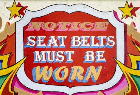 ENGLAND, West Sussex, Findon, Findon village Sheep Fair Colourful red sign on a fairground ride