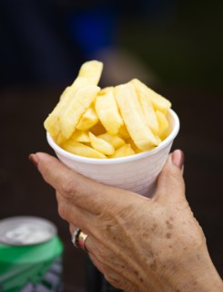 ENGLAND, West Sussex, Findon, Findon village Sheep Fair Elderly lady holding a polystyrene mug full