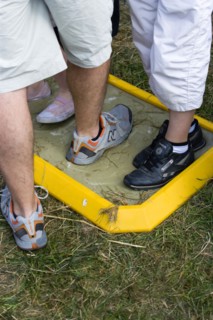 ENGLAND, West Sussex, Findon, Findon village Sheep Fair People walking through a foot bath at a Bio