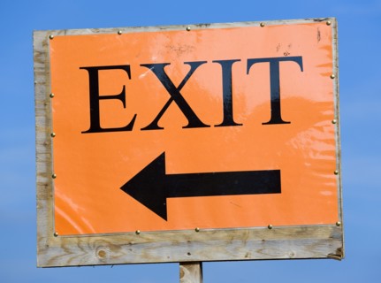 ENGLAND, West Sussex, West Dene, An orange sign with black writing that reads Exit and has an arrow