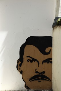 ENGLAND, East Sussex, Brighton, "Little East Street, Mural of mans Head sprayed on wall."
