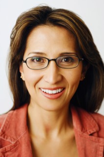 PEOPLE, Adult, Female, Portrait of a mid adult woman smiling and wearing glasses.