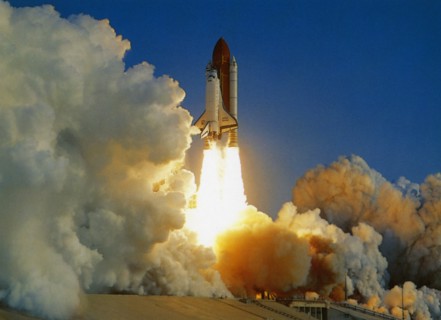 USA, Florida, Kennedy Space Centre, NASA Space Shuttle lifting off amidst thick white clouds of