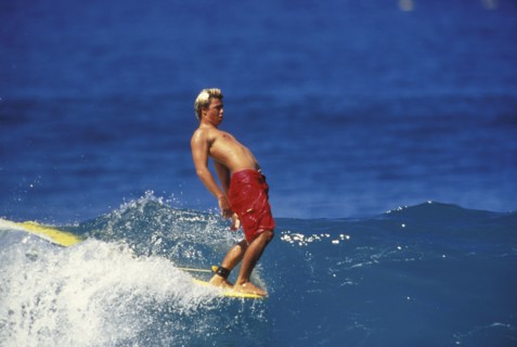 SPORT, Sea, Surfing, "Surfer hangs ten.  Male surfer walks to the point of the board and hangs ten