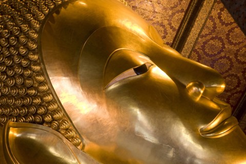 THAILAND, Central, Bangkok, Wat Pho also known as Wat Phra Chetuphon. Close up of the face of the