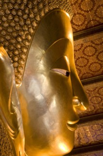 THAILAND, Central, Bangkok, Wat Pho also known as Wat Phra Chetuphon. Close up of the face of the