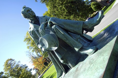 USA, New York State, Cooperstown, Statue of James Fenimore Cooper in Cooper Park next to Baseball