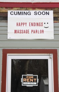 USA, New Hampshire, Keene, "Sign on building, cuming soon, Happy Endings Massage Parlor."