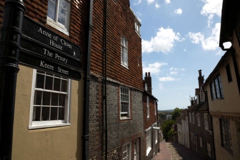 ENGLAND, East Sussex, Lewes, "High Street, Keere Street cobbled pathway with traditional buildings