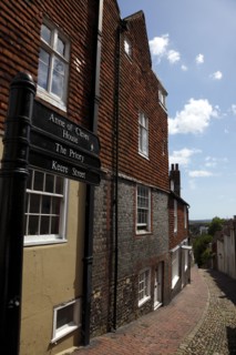 ENGLAND, East Sussex, Lewes, "High Street, Keere Street cobbled pathway with traditional buildings