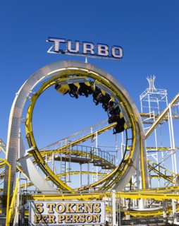 ENGLAND, East Sussex, Brighton, Turbo rollercoaster amusement ride on Brighton Pier with the cars