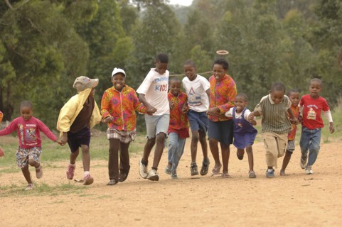 AFRICA, Children , Playing, School Children running on dirt road.