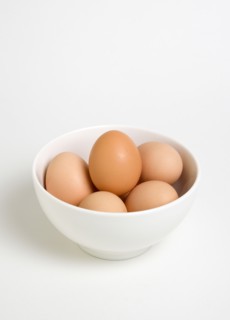 FOOD, Uncooked, Eggs, Free range eggs in a bowl on a white background.