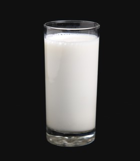 DRINK, Milk, Glass, Tumbler glass of dairy milk on a black background.