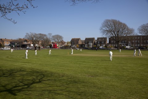 England, West Sussex, Southwick, Local Cricket team playing on village green.