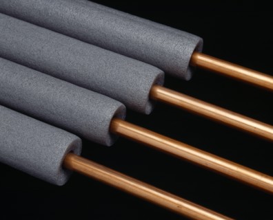 Architecture, Materials, Plumbing, Copper pipes with grey foam pipe lagging.