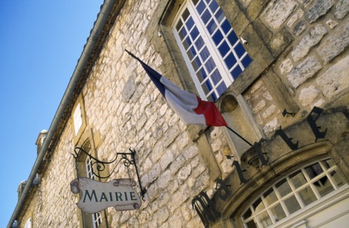 France, Aquitaine, Villefranche-du-Perigord, Mairie Town Hall stone building with French Tricolour