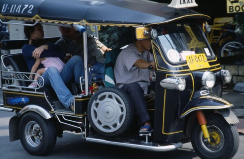 Thailand, North, Chiang Mai, Local family with young child as passengers in a Tuk Tuk three wheeled