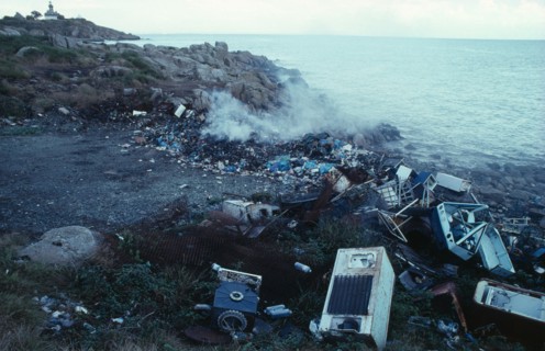 Pollution, Environment, Dumped fridges at watersedge releasing CFC gases into the atmosphere, along