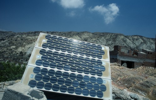 Environment, Alternative Energy, Solar Panel, Modern solar panel perched on traditional tiled
