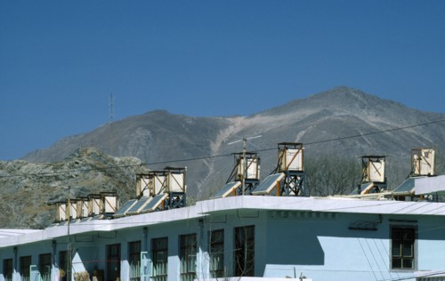 Tibet, Lhasa, Solar panels on roof of building.
