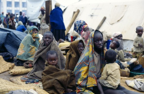 Congo, Bukavu, Rwandan refugees wrapped in blankets without shelter.