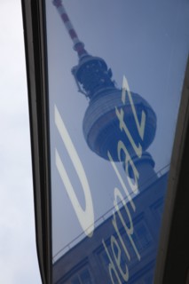 Germany, Berlin, U Bahn sign for Alexanderplatz with Fernsehturm reflected  in the glass